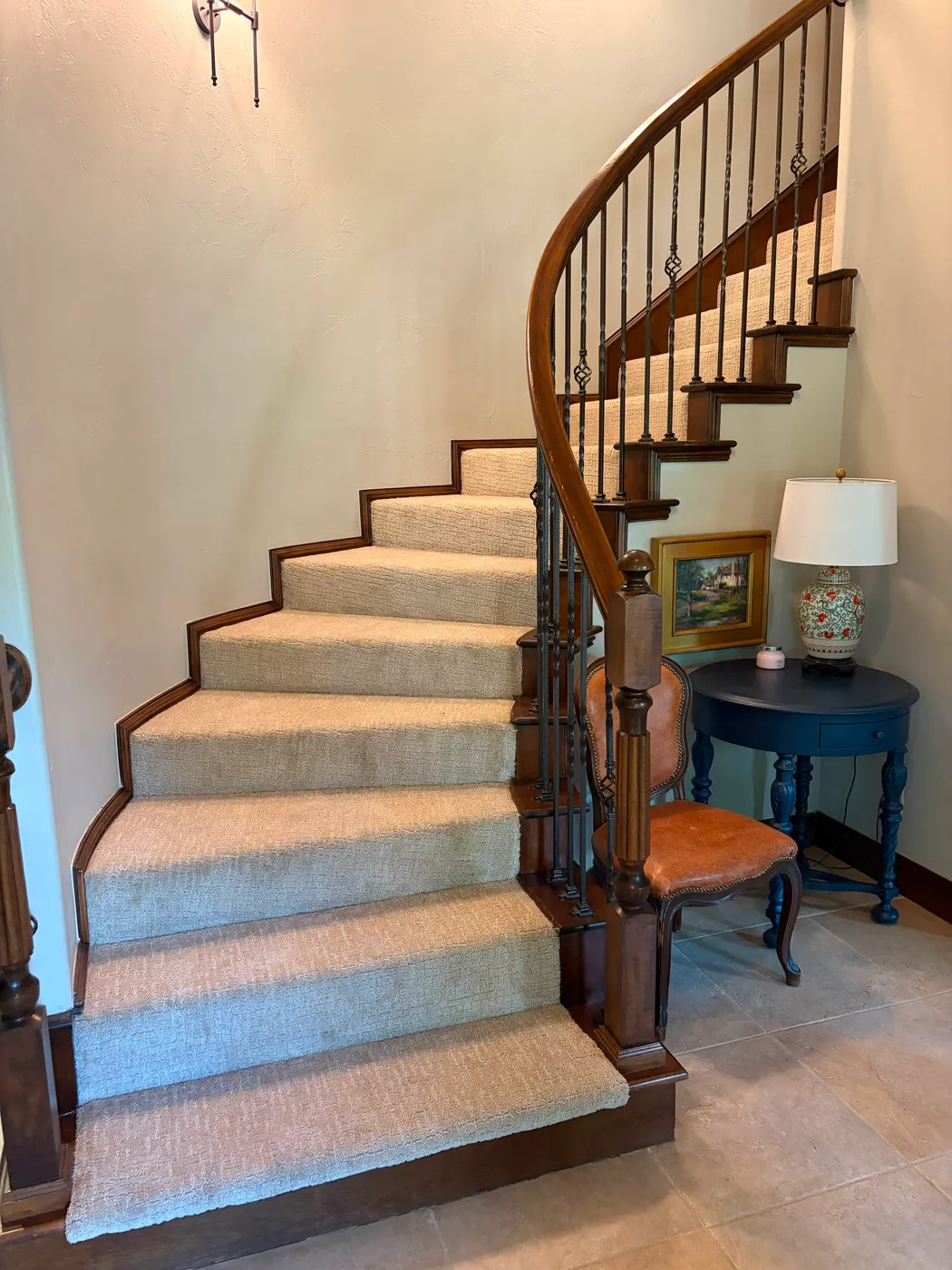 Curved staircase wrapped in soft neutral carpet by Floors To You OKC in an Oklahoma City home