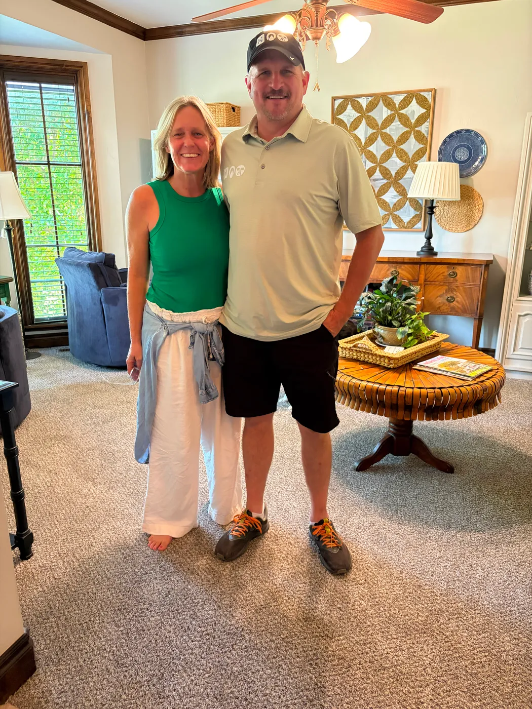 Happy Oklahoma City homeowners standing in their newly carpeted living room